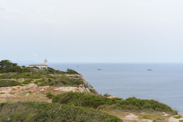 Fototapeta na wymiar Lighthouse at Far de Cap Blanc in Mallorca, Spain
