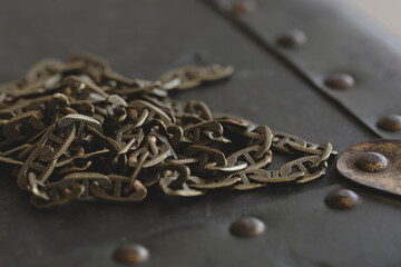 Close up view of a bunch of chain on vintage box