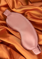 A mask for sleeping and meditation on a silk sheet