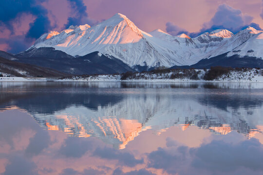 Beautiful view of lake campotosto in the mountain area of gran sasso italy during winter sunset © Buffy1982