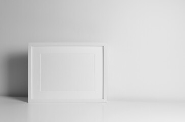 Blank frame mockup in white minimalistic interior. Landscape frame for artwork presentation