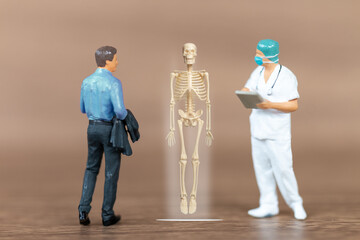 Miniature people patients are discussed  by an orthopedic physician