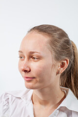 Fototapeta premium drops in the nose from a cold in a young girl