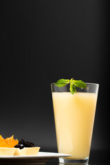 freshly squeezed cantaloupe juice, cantaloupe nut mix with cocktail and melon slice, black background and dark theme