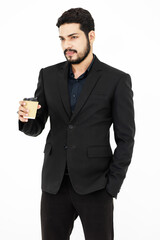 Portrait studio shot of Millennial Indian bearded male professional successful businessman ceo entrepreneur in formal suit standing on white background.