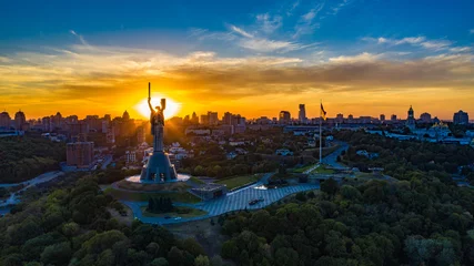 Foto op Aluminium Kiev Aerial view to the Motherland statue in the Kiev while  summer sunset. The well-known landmarks in Kyiv. Historical monument of Soviet union. Beautiful city Kiev while sunset.