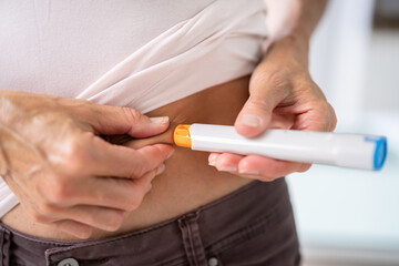 Medicament Self Injection In Belly Using Syringe