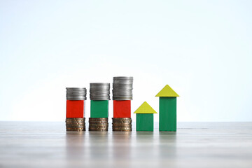 Wooden blocks formed house models and were sandwiched between stacked coins. Noise is visible due to the texture of the subjects