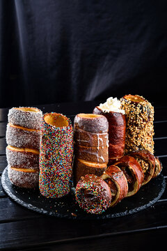 Trdelnik or trdlo is traditional czech sweet hollow roll pastry dough covered with sugar, chocolate, almond, cinnamon or poppy