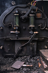 Fototapeta na wymiar Darjeeling, West Bengal, India - Close up detail of steam engine toy train of Darjeeling Himalayan railway at station, Darjeeling Himalayan railway is a UNESCO world heritage site, Selective focus.