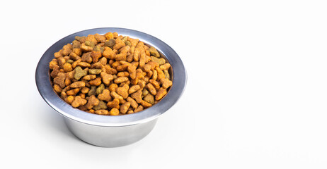 Round metal bowl for pets with dry food. Isolated on white background. View from above. Full plate with a slide