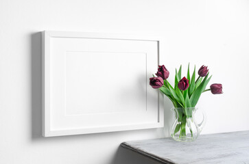 Blank landscape frame mockup with spring tulips flowers