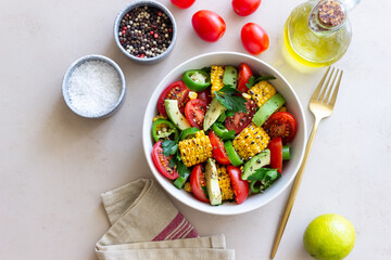 Salad with corn, avocado, tomatoes, peppers and parsley. Healthy eating. Vegetarian food.