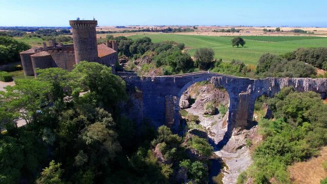 Vulci Archeological and Nature Park.  Aerial view of Castello dell'Abbadia and ancient bridge of etruscan city Vulci   Viterbo province, Lazio, Italy
