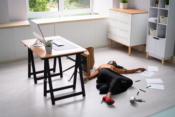 Businesswoman Fallen From Office Chair