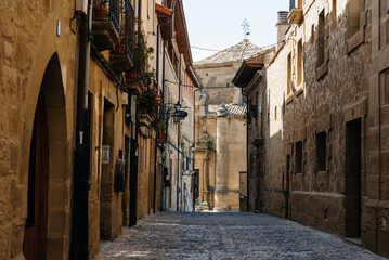 Cobblestoned street in the medieval town of Briones, Rioja, Spain. Picturesque And Narrow Streets On A Sunny Day. Architecture, Art, History, Travel