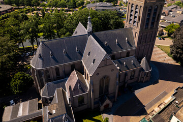 Top down aerial view of historic Dutch city Groenlo with church Saint Calixtusbasiliek rising above the authentic medieval rooftops