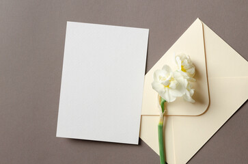 Invitation card mockup with envelope and daffodils flowers