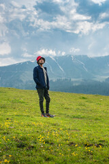 Young handsome man on a mountain top, Gulmarg, Jammu and Kashmir, India.