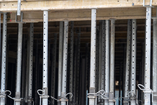 telescopic steel support bars acrow props supporting the ceiling on the construction site