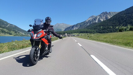 Driving a Motorcycle through the mountains in Austria.