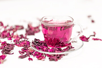 Infusion of hibiscus sabdariffa on a white background. Tea drink from the Sudanese rose, karkade