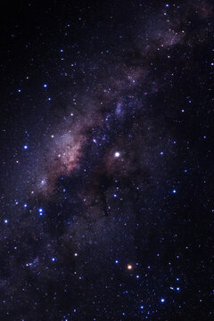 Milky way galaxy with stars and space dust in the universe, Long exposure photograph, with grain. © sripfoto