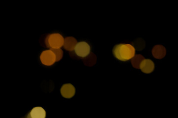 orange defocused lights on a dark background. overlay