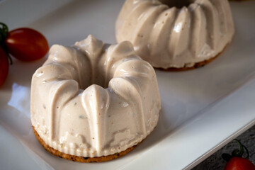 Portioned tuna mousse on a cracker.
