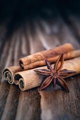 Cinnamon sticks and anise on an old wooden table