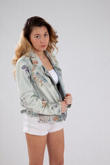 Thoughtful young woman in a jean jacket