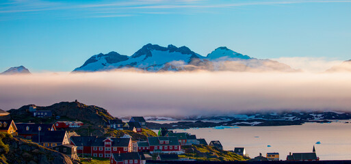 A layer of fog spreads between the mountains and the sea -Picturesque village and Colorful houses...