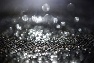 Fototapeta premium Background of abstract glitter lights. Gold, silver and black bokeh banner.