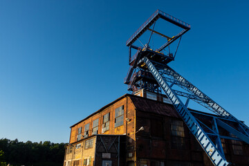 The shaft tower of a closed black coal mine. Decarbonization processes in the modern world during the energy crisis