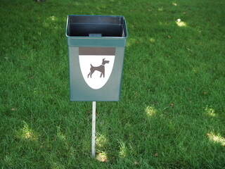Close Up of Bright Green Dog Mess Poop Bin with Label