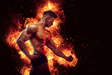Fototapeta na wymiar Brutal strong athletic Bodybuilder posing. Fire and spark explosion in the background.