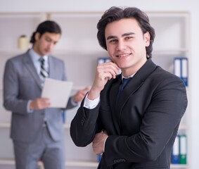 Two young businessmen meeting in the office