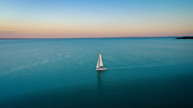 Aerial View Of Sailboat At Sunset