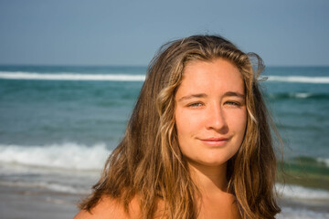 Beautiful young woman walking alone on the beautiful beaches of southwestern France