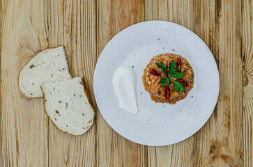 Rice with vegetables on white plate top view