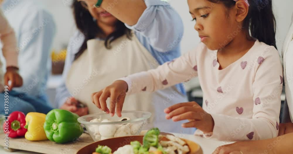 Canvas Prints Happy family cooking dinner together in the home kitchen at home. Young girl helping her grandmother prepare a healthy meal with vegetables. Independent daughter making food with an older woman