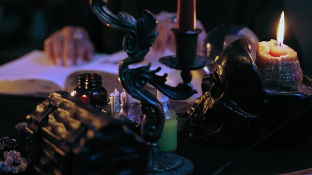 Witch with supernatural powers reading magic spell in mysterious atmosphere