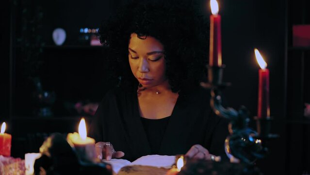 Enchantress reading magic book, preparing for occult ritual, mystic atmosphere