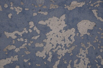 blue wall worn and white paint visible, background