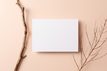 Greeting or invitation card mockup with wooden twigs on beige background