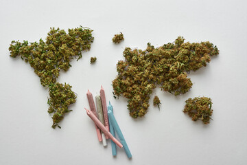 World map from marijuana and cannabis rolled joint