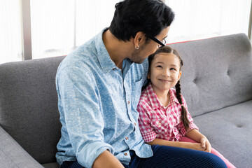 Asian Father and daughter, smile, hug and playing with doll and toy together inside of the living room. Happy moment with male parent, family relationship.