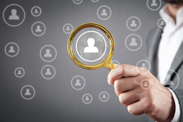 Man showing magnifying glass with a human symbols. Human Resources