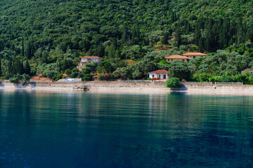 Ithaka island, calm anchorage spot, beautiful natural bay, blue sea, green forest mountains, amazing landscape and seascape, small village houses