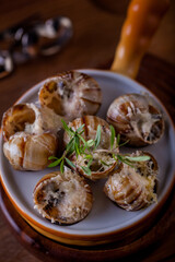 Snails with parmesan cheese